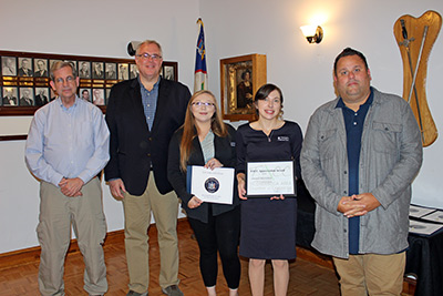 Five People Holding Certificates