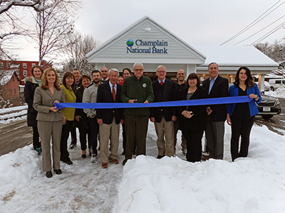 Group of People Cutting Big Ribbon