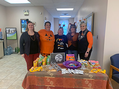 Five Girls Wearing Halloween Shirts and Headbands