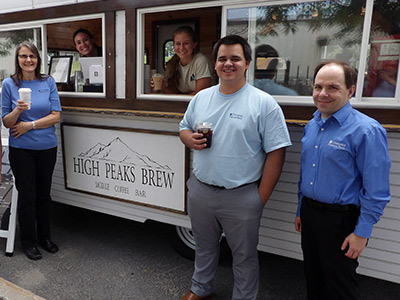 Laurie, Vinny, and Todd Standing in Front of High Peaks Brew Trailer