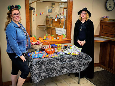 Melanie and Alison Standing Next to Treats Table