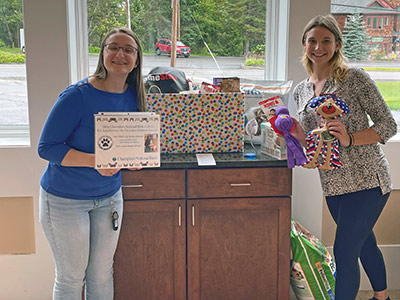 Emily and Tori Holding Dog Toys