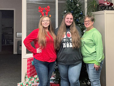 Group of People Wearing Holiday Sweaters