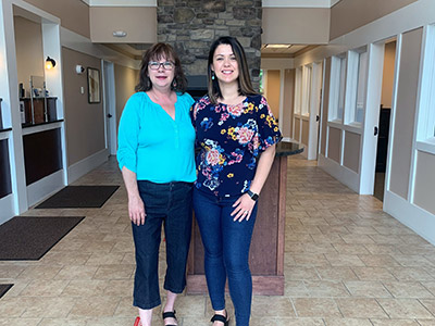 Two Women Wearing Jeans